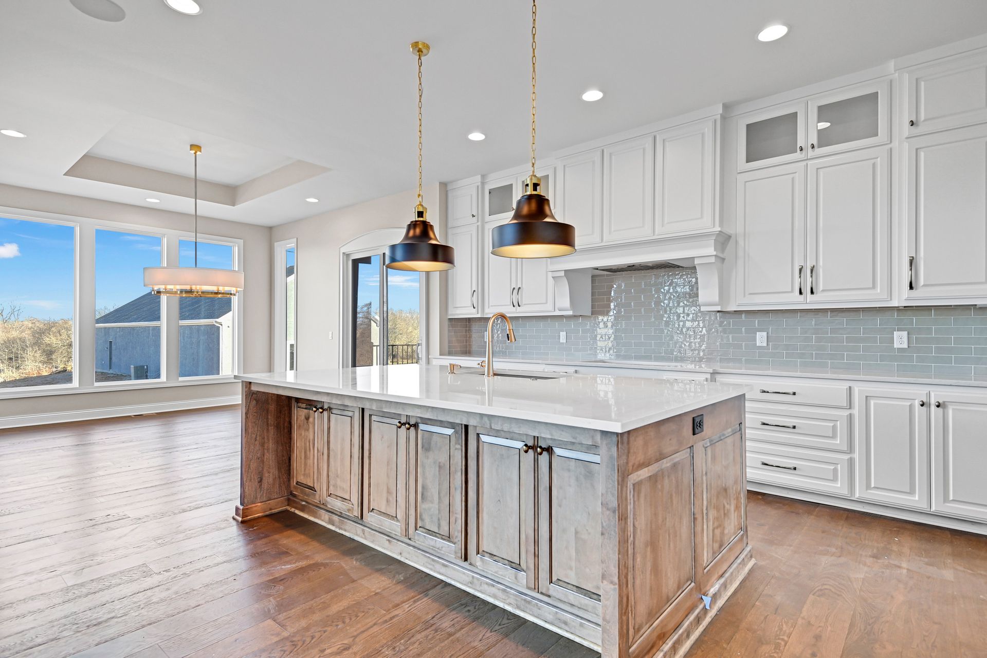 There is a large island in the middle of the kitchen.