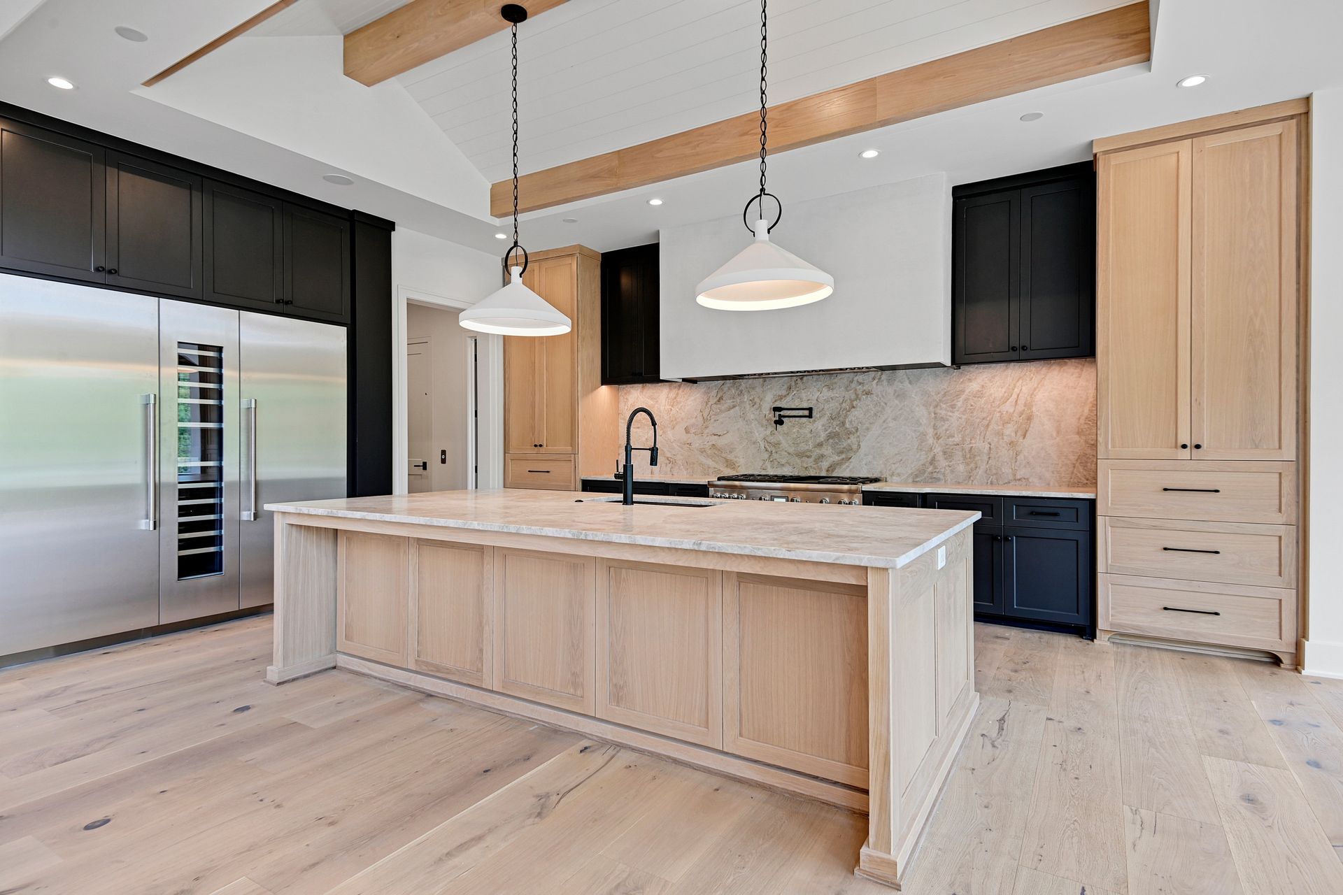There is a large island in the middle of the kitchen.