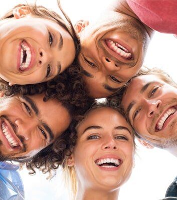 Happy friends embracing — Dental Care in Greenville, SC