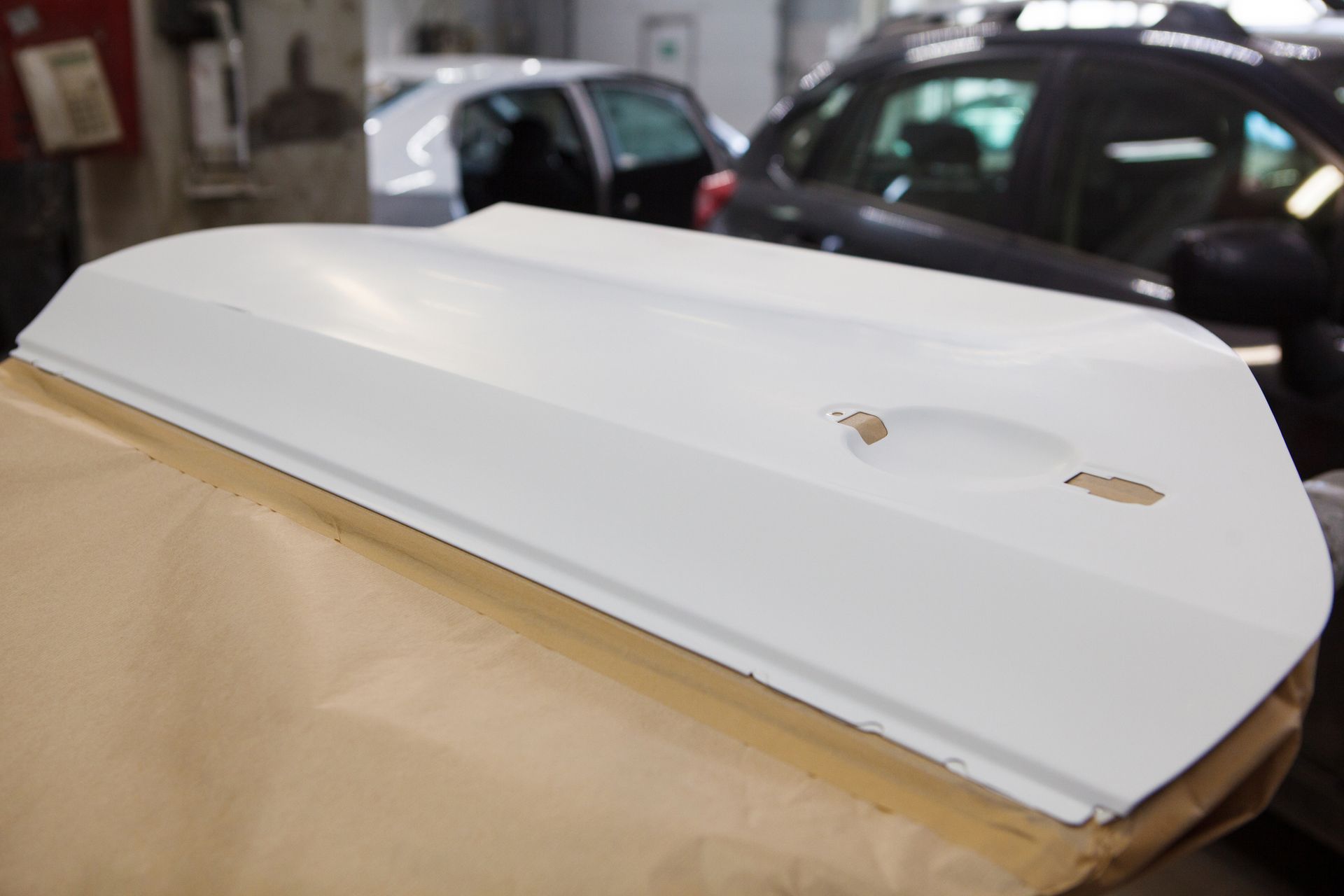 A white door is sitting on top of a piece of paper.