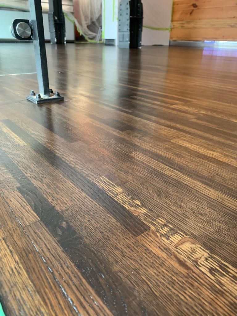 a close up of a wooden floor in a room .