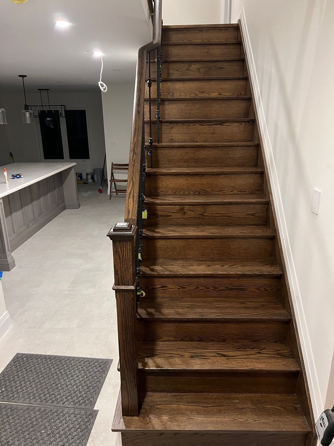 A wooden staircase leading up to the second floor of a house.