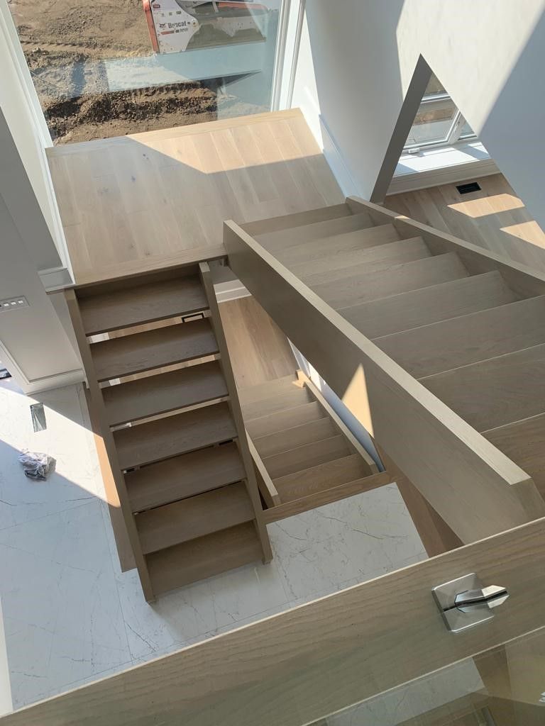 A wooden staircase leading up to the second floor of a house.
