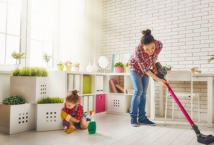Mother and child clean the house — House Cleaning in Los Angeles, CA