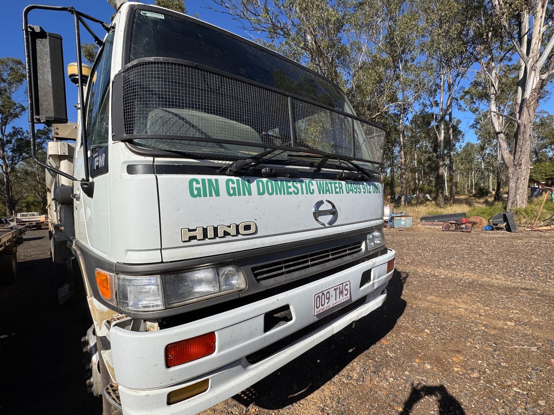Blue Water Tanks on A Rooftop — Gin Gin Domestic Water Supplies in Wallaville, QLD