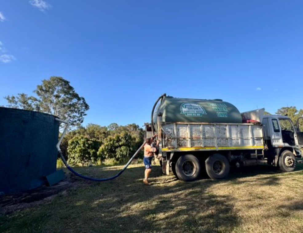 Blue Truck with A Large White Tank — Gin Gin Domestic Water Supplies in Wallaville, QLD