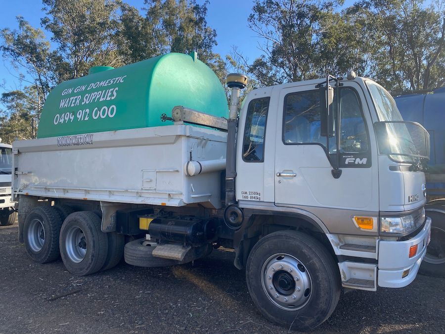 White Water Tanker Truck With Green Tank, Parked Outside — Gin Gin Domestic Water Supplies in Wallaville, QLD