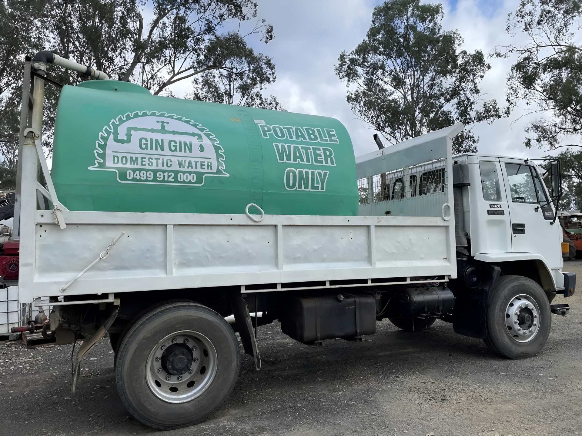 White Water Tanker Truck With a Green Tank, Parked Outdoors — Gin Gin Domestic Water Supplies in Wallaville, QLD