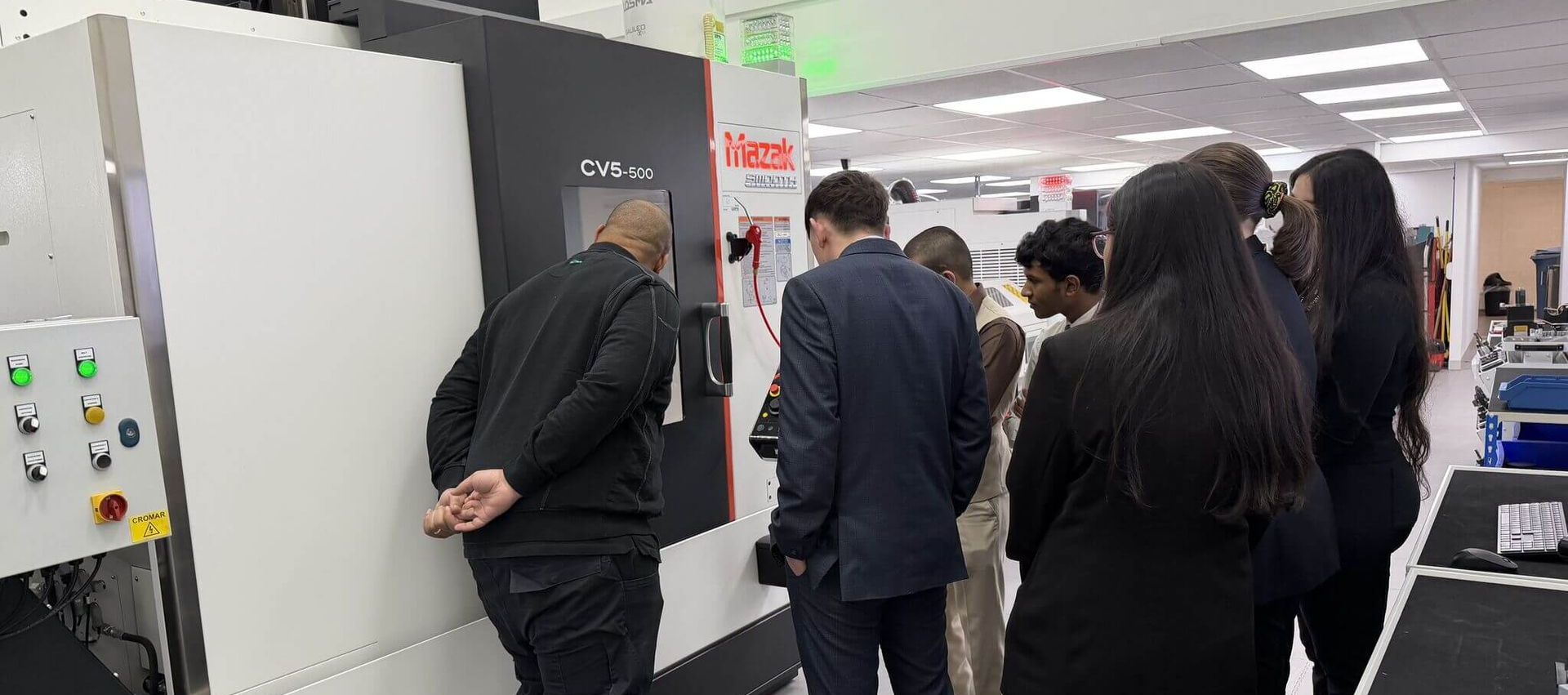 ILAC - MRA and UKAS Calibration Logo on a blurred picture of a test rig.