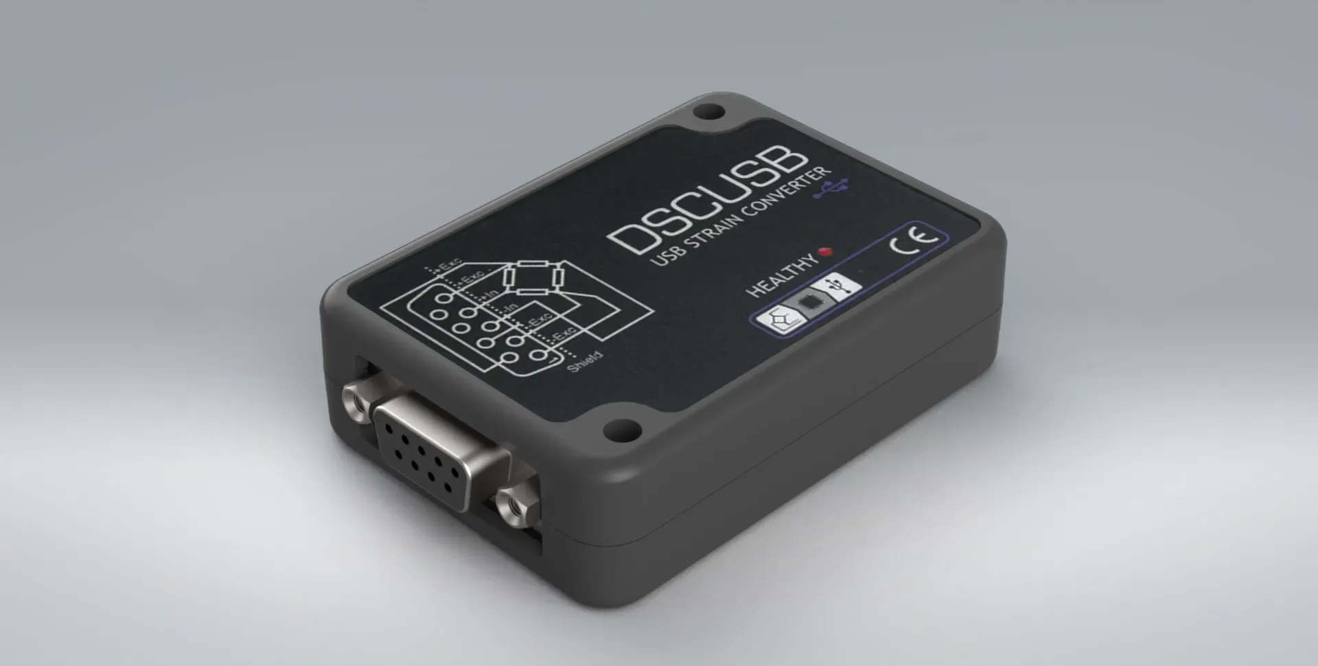 Small, black DSCUSB strain gauge to USB converter on a plain grey backdrop with clear readings on the screen.