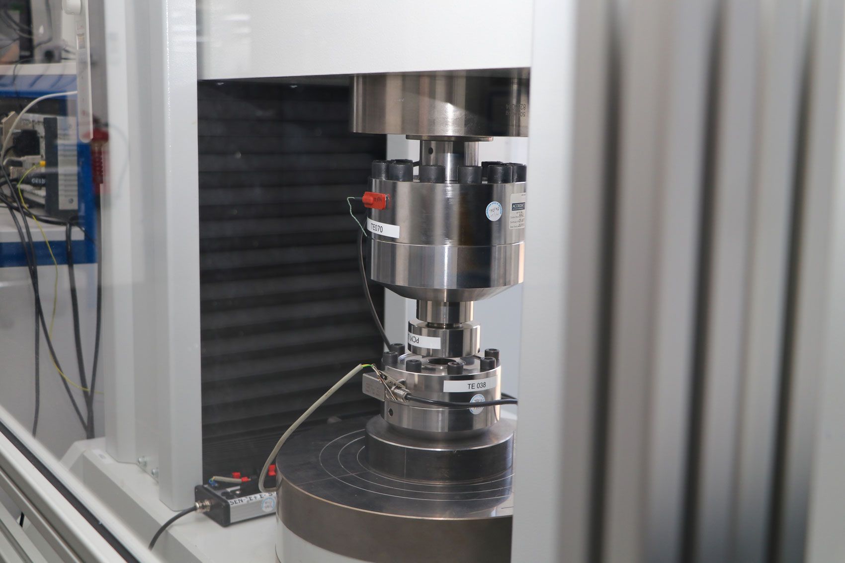 A precise load cell being calibrated by Procter and Chester Measurements