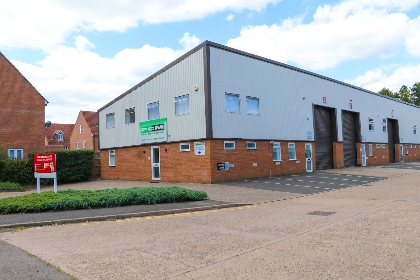 A large building with a lot of windows is for sale.