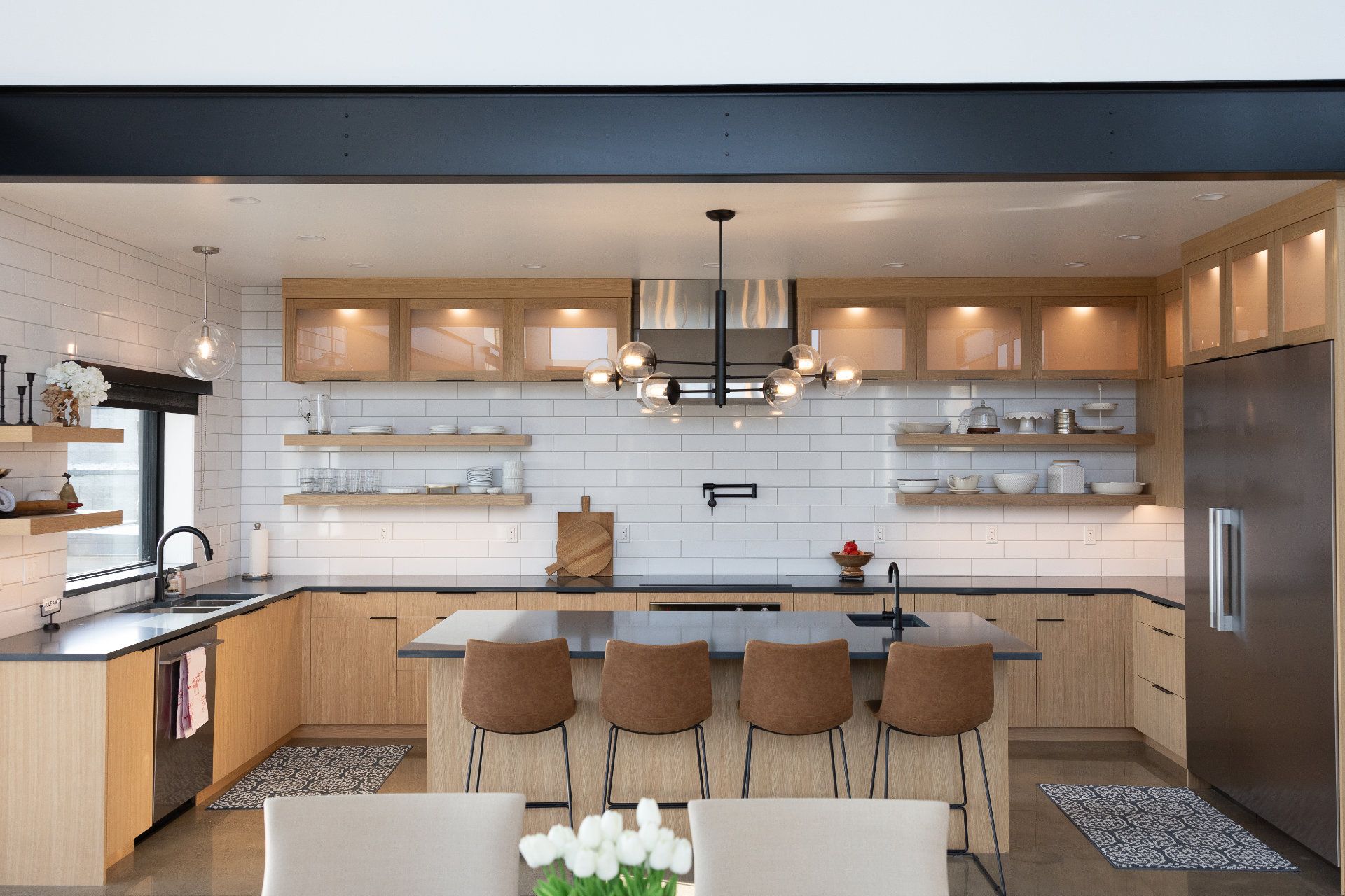 A kitchen with stainless steel appliances and wooden cabinets