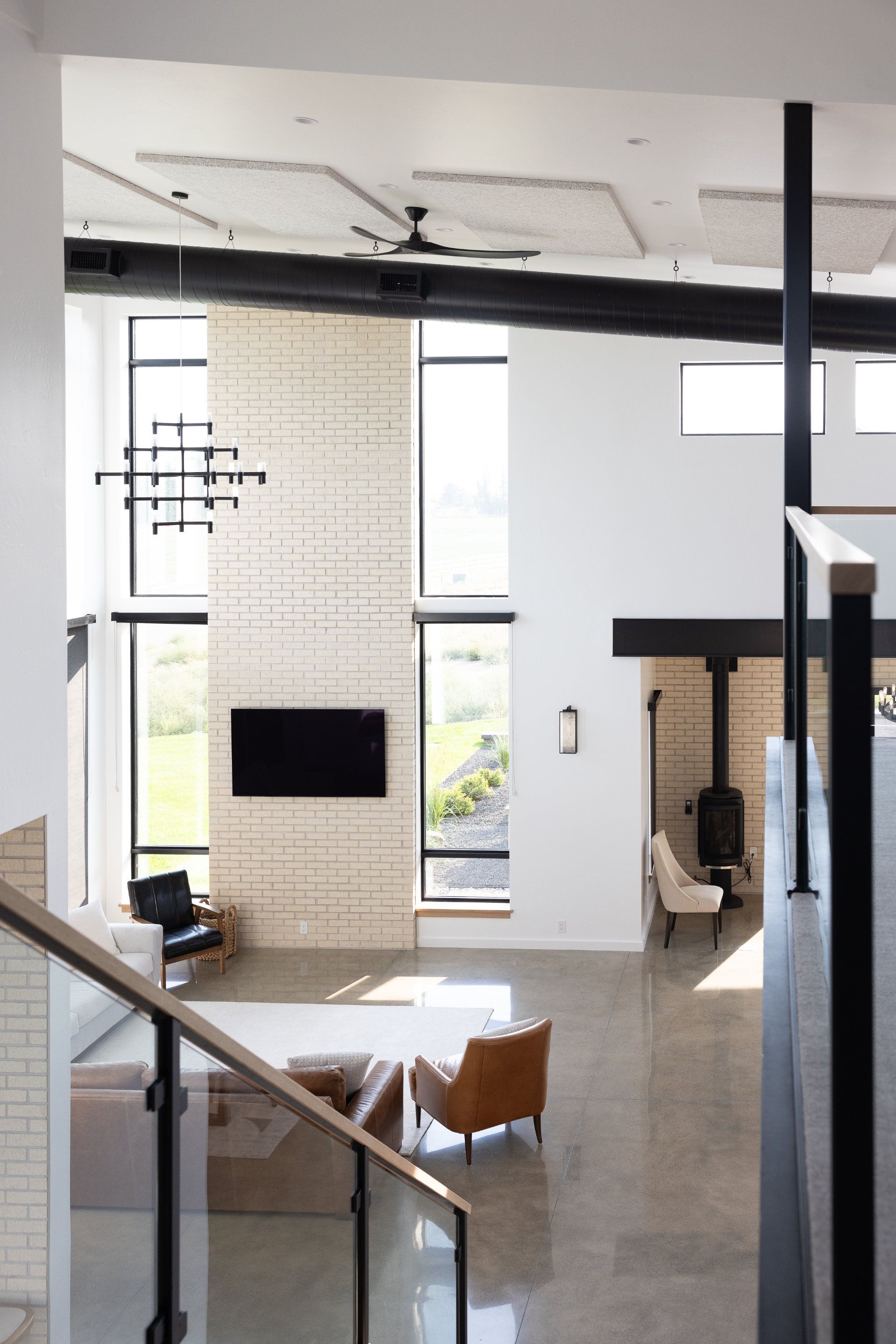 A living room with a large flat screen tv on the wall
