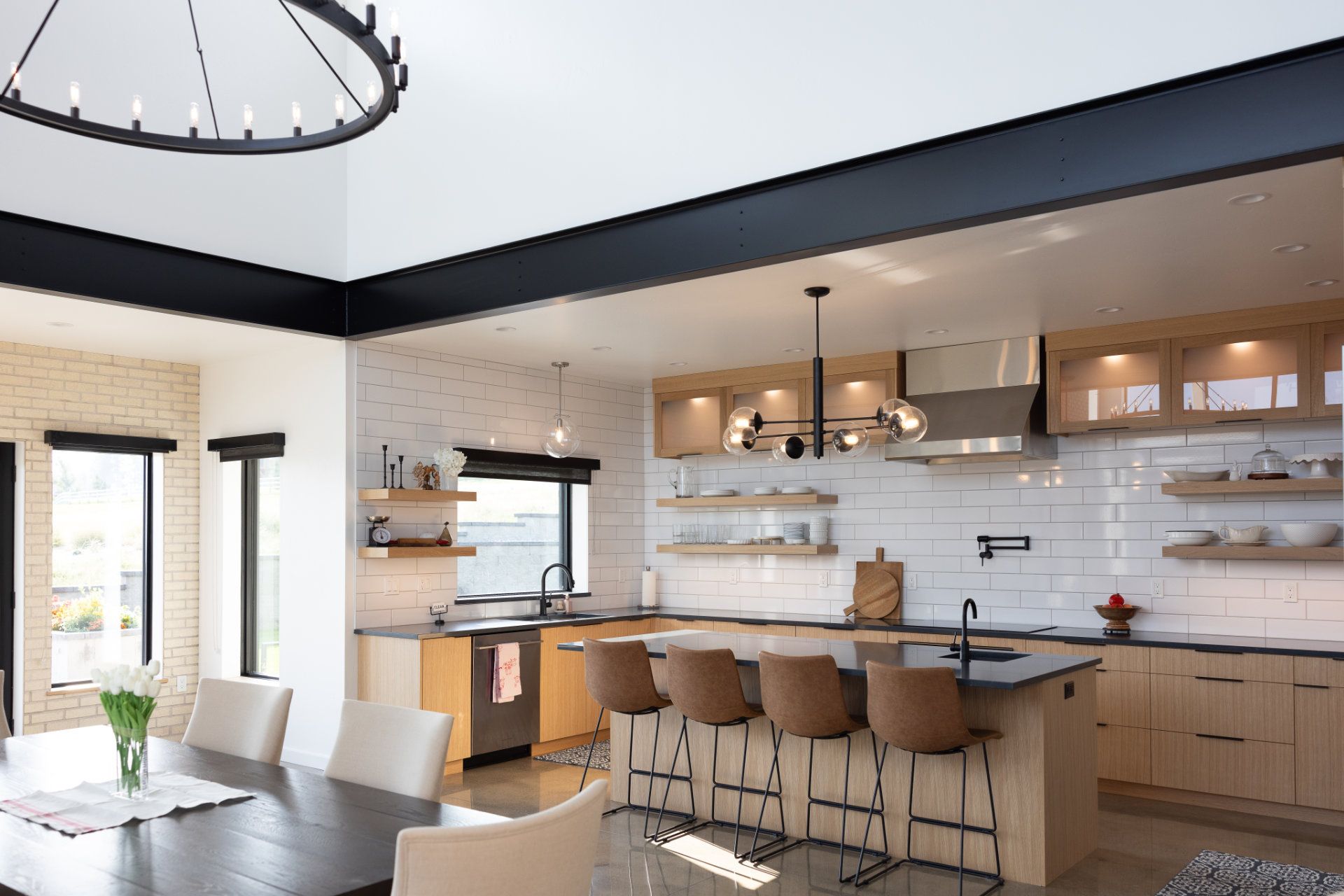 A kitchen with a table and chairs in it