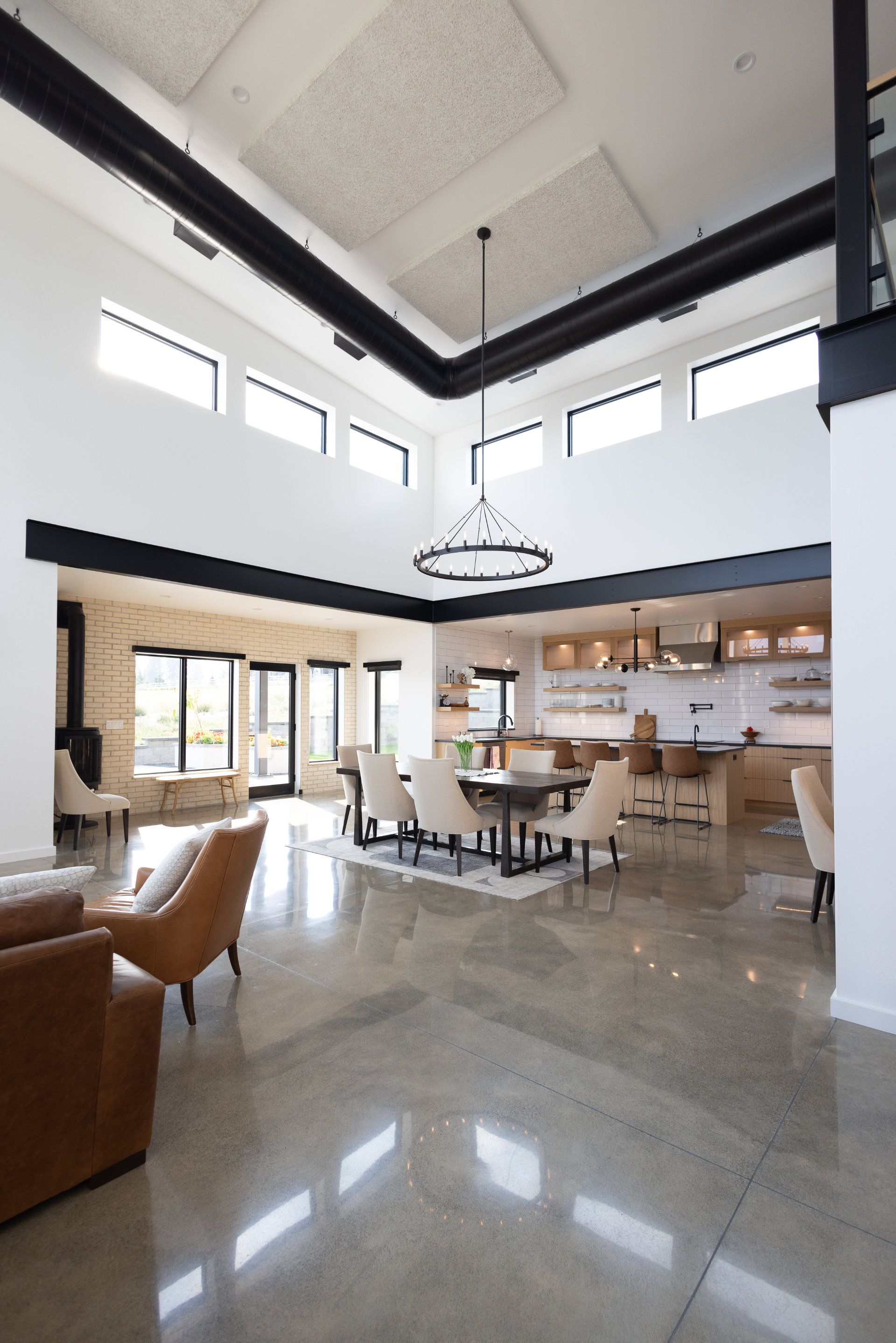 A large room with a table and chairs in it