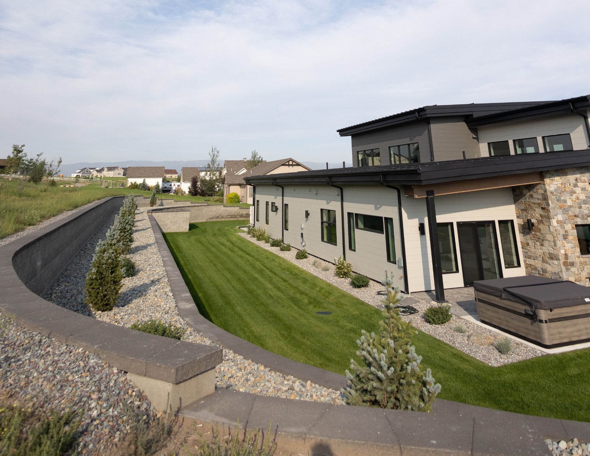 A large house with a hot tub in the backyard.