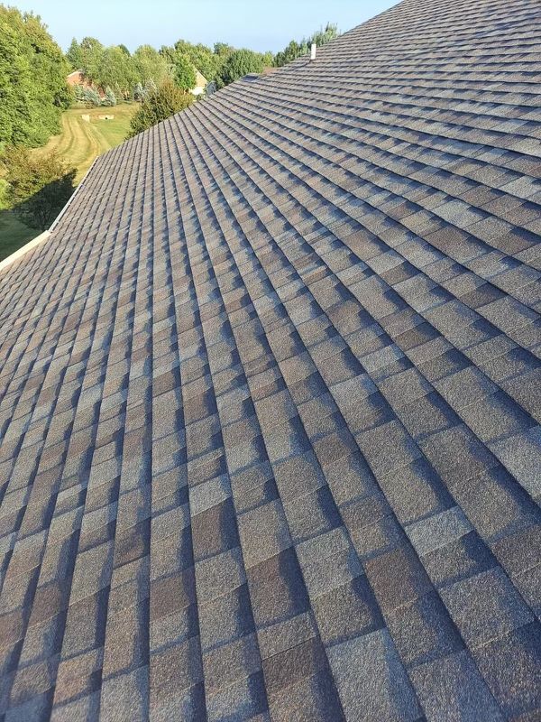 A close up of a roof with a lot of shingles on it.