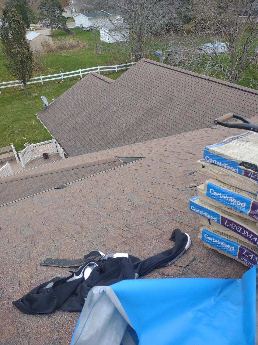 A stack of boxes on the roof of a house