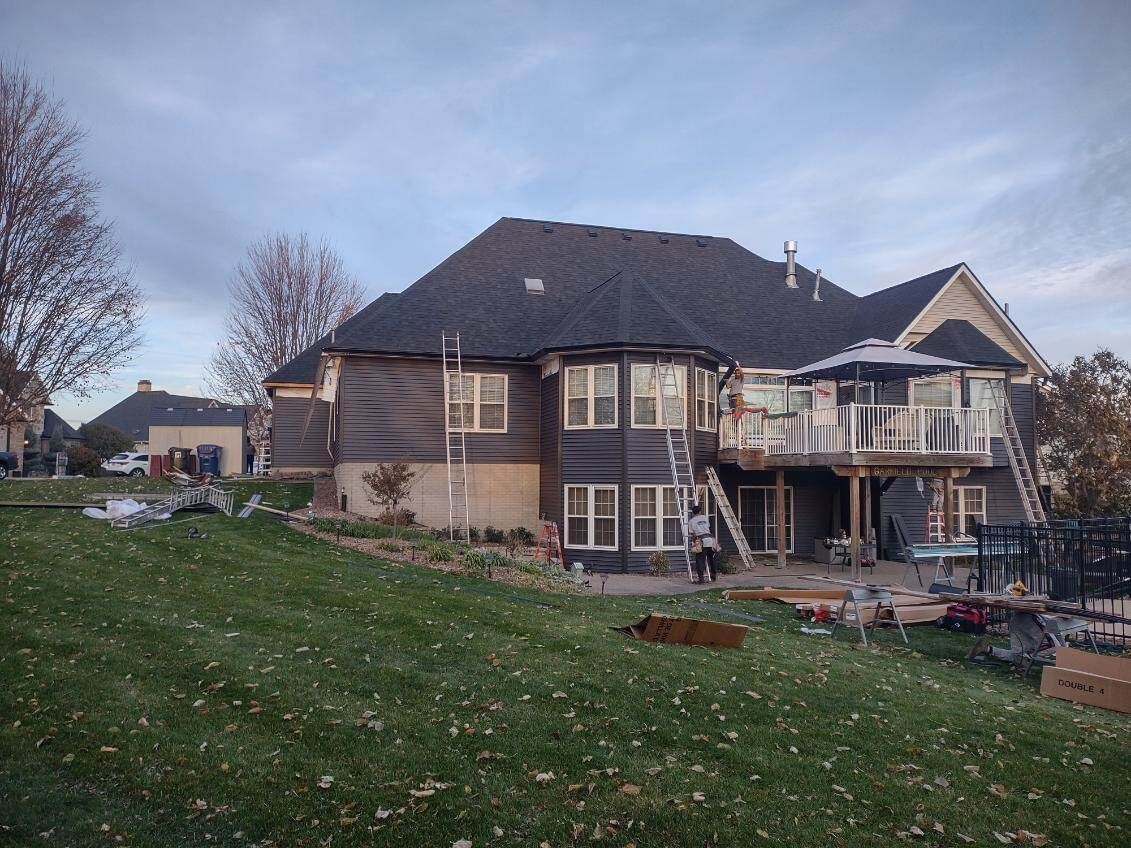 A large house is being built in a residential area.