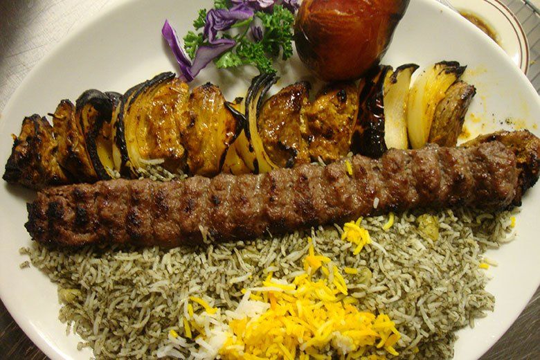 A plate of food with rice and meat on it