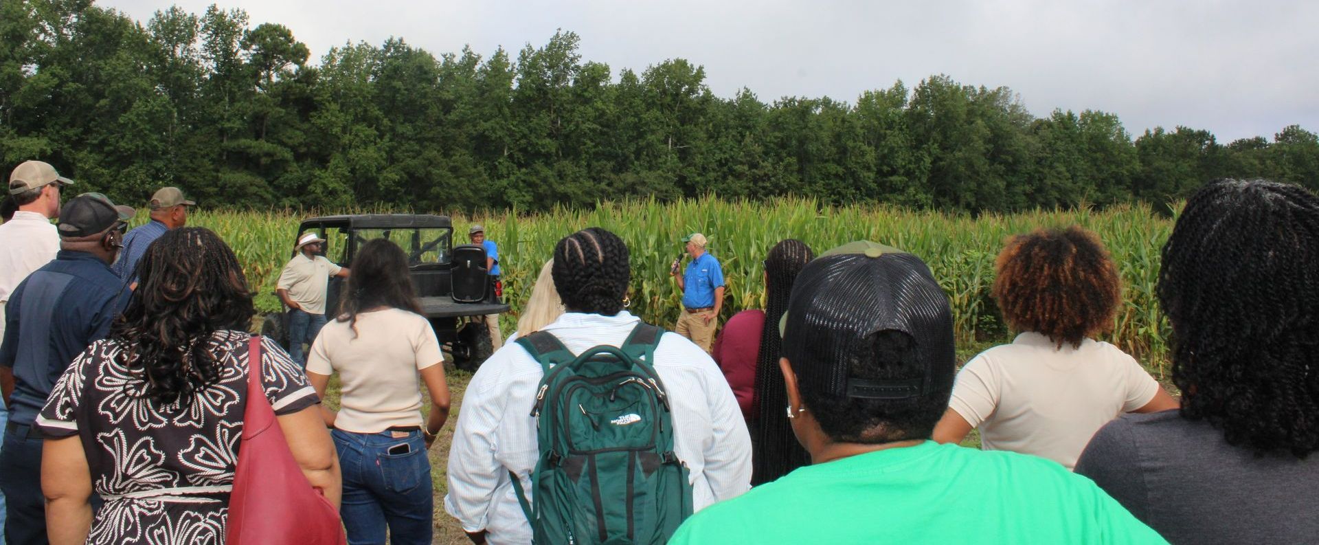 Group of farmers and agricultural professionals as well the Tennie Agriculture Group.
attending a crop demonstration event.
