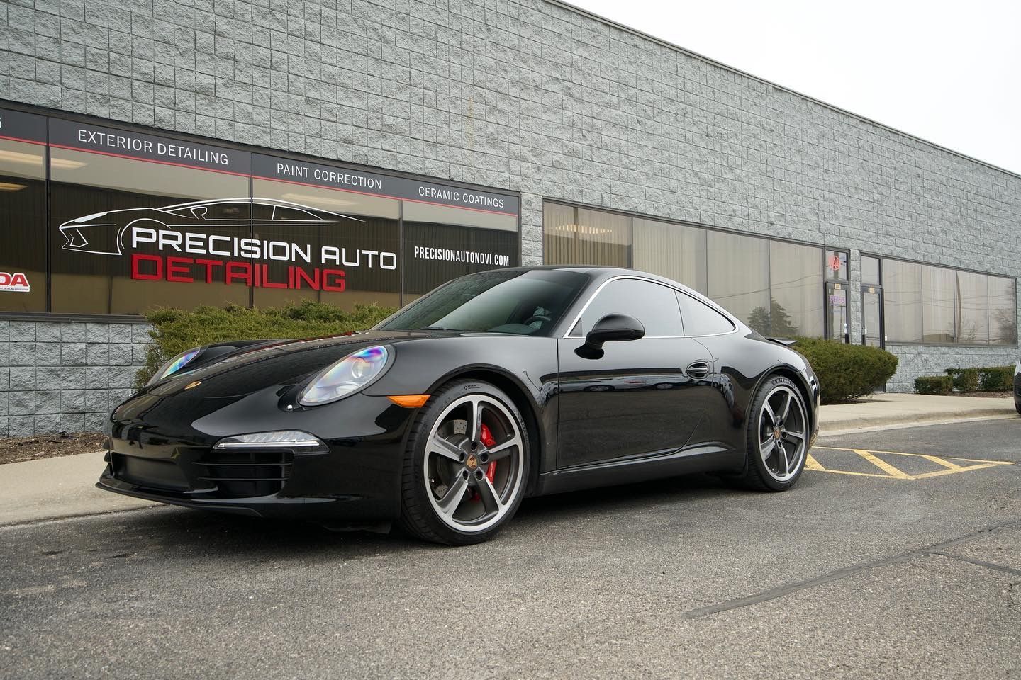 Luxury vehicle treated with ceramic coating in Novi for superior sun protection, maintaining glossy.
