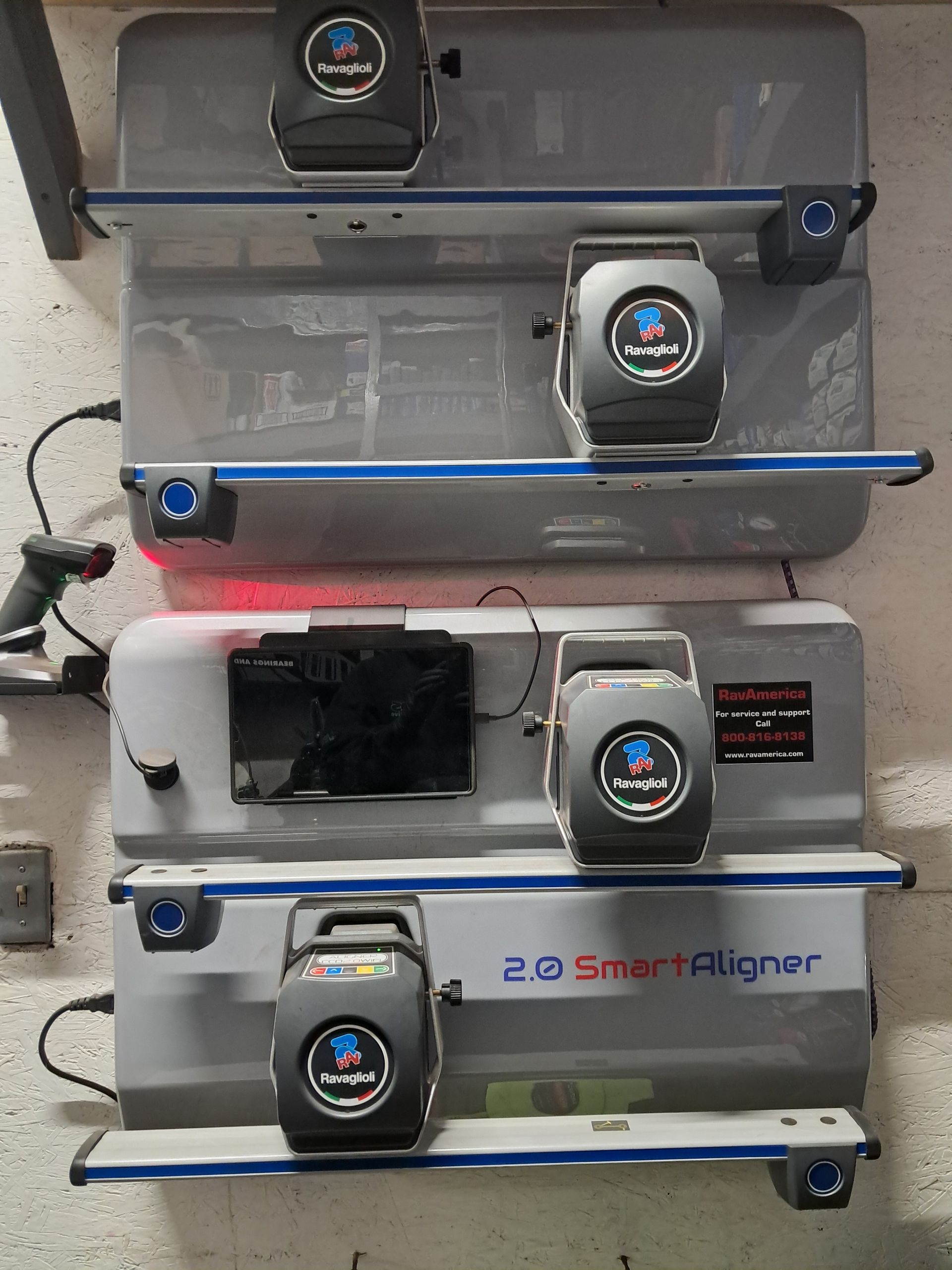 White Saturn sedan parked on gravel with a person standing next to it. | MDS Automotive