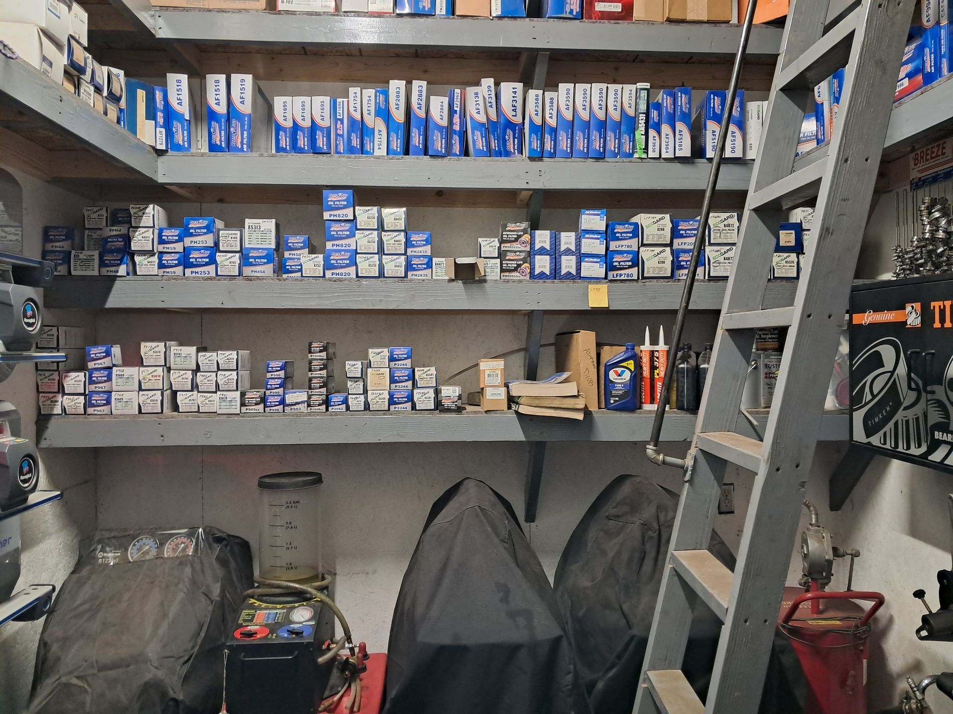 Blue tire machine and balancer in a garage setting. | MDS Automotive