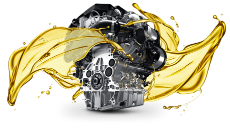 A car engine surrounded by dynamic, swirling splashes of golden motor oil against a white background.