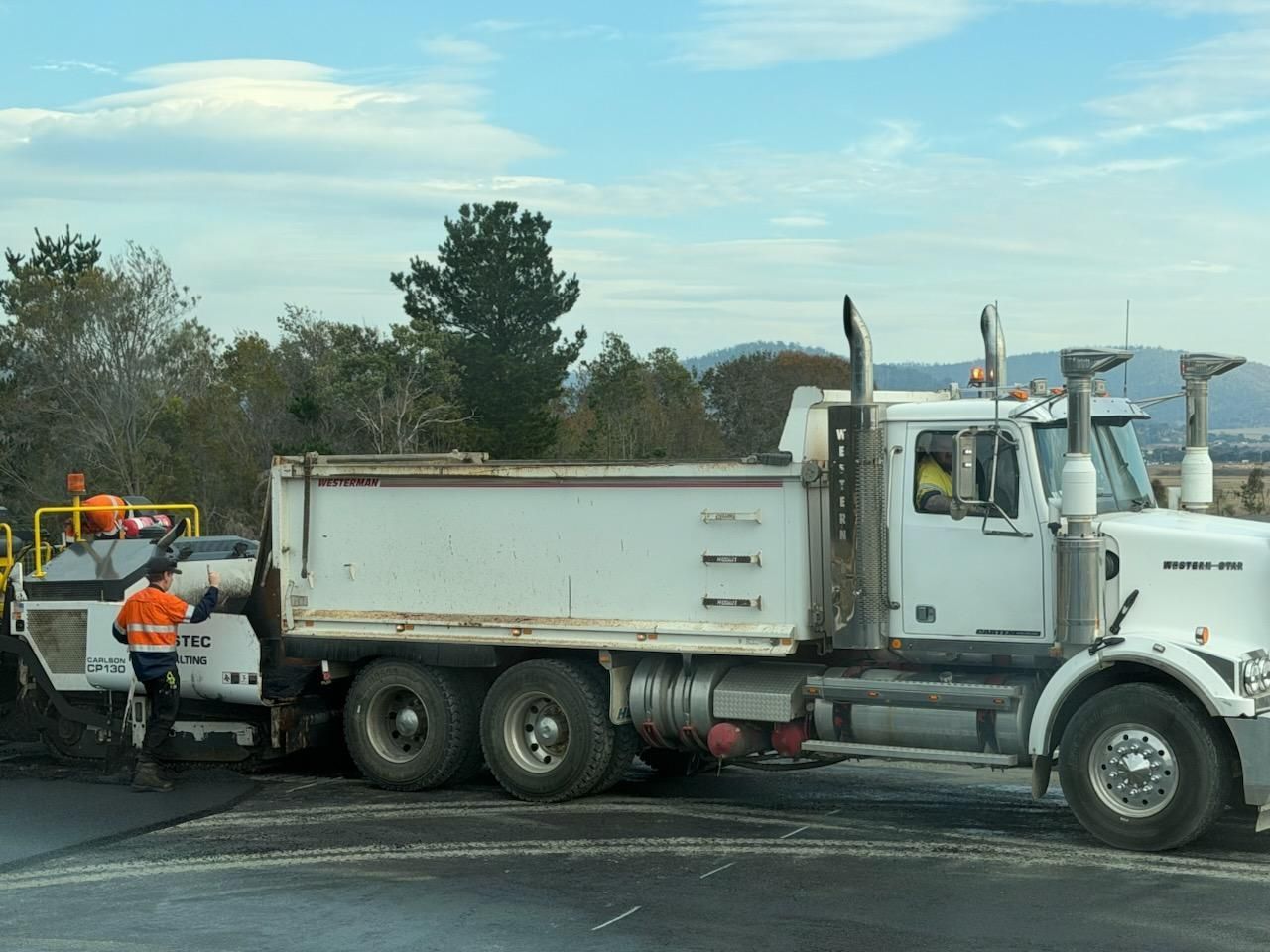 Workers Loading Asphalt into a White Dump Truck  — CartEX in Mornington, TAS