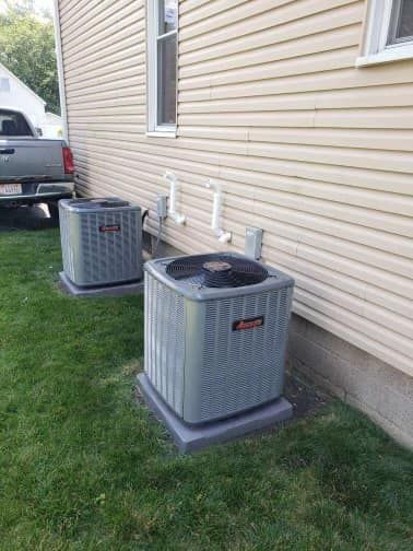 Man Wearing Watch Working On Air Conditioner - Saint John, IN - Elite Comfort Heating And Air Conditioning LLC