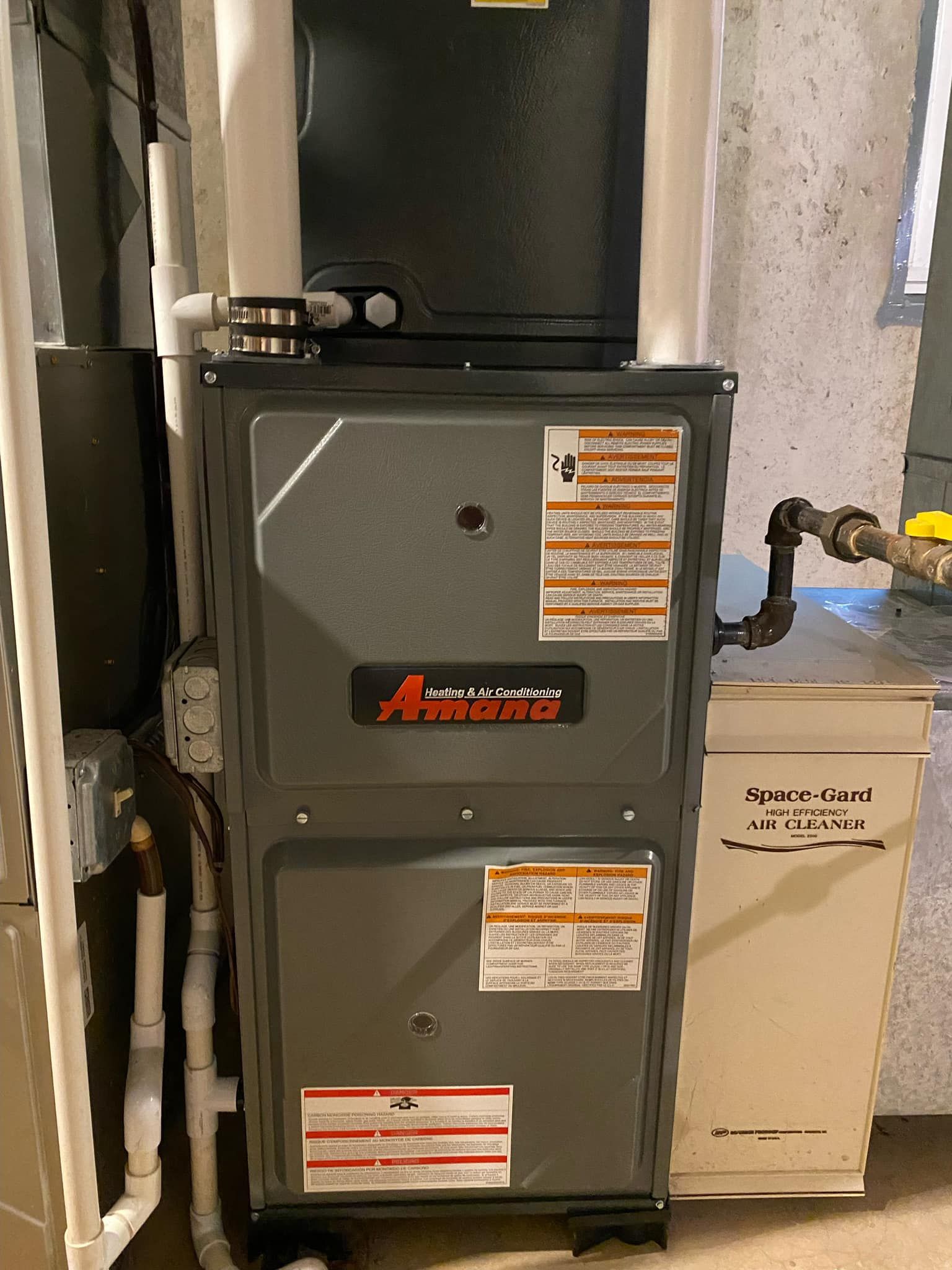 Man Is Fixing Boiler - Saint John, IN - Elite Comfort Heating And Air Conditioning LLC