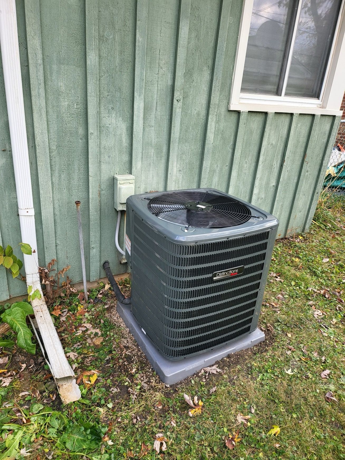 Man Is Fixing An Air Conditioner - Saint John, IN - Elite Comfort Heating And Air Conditioning LLC