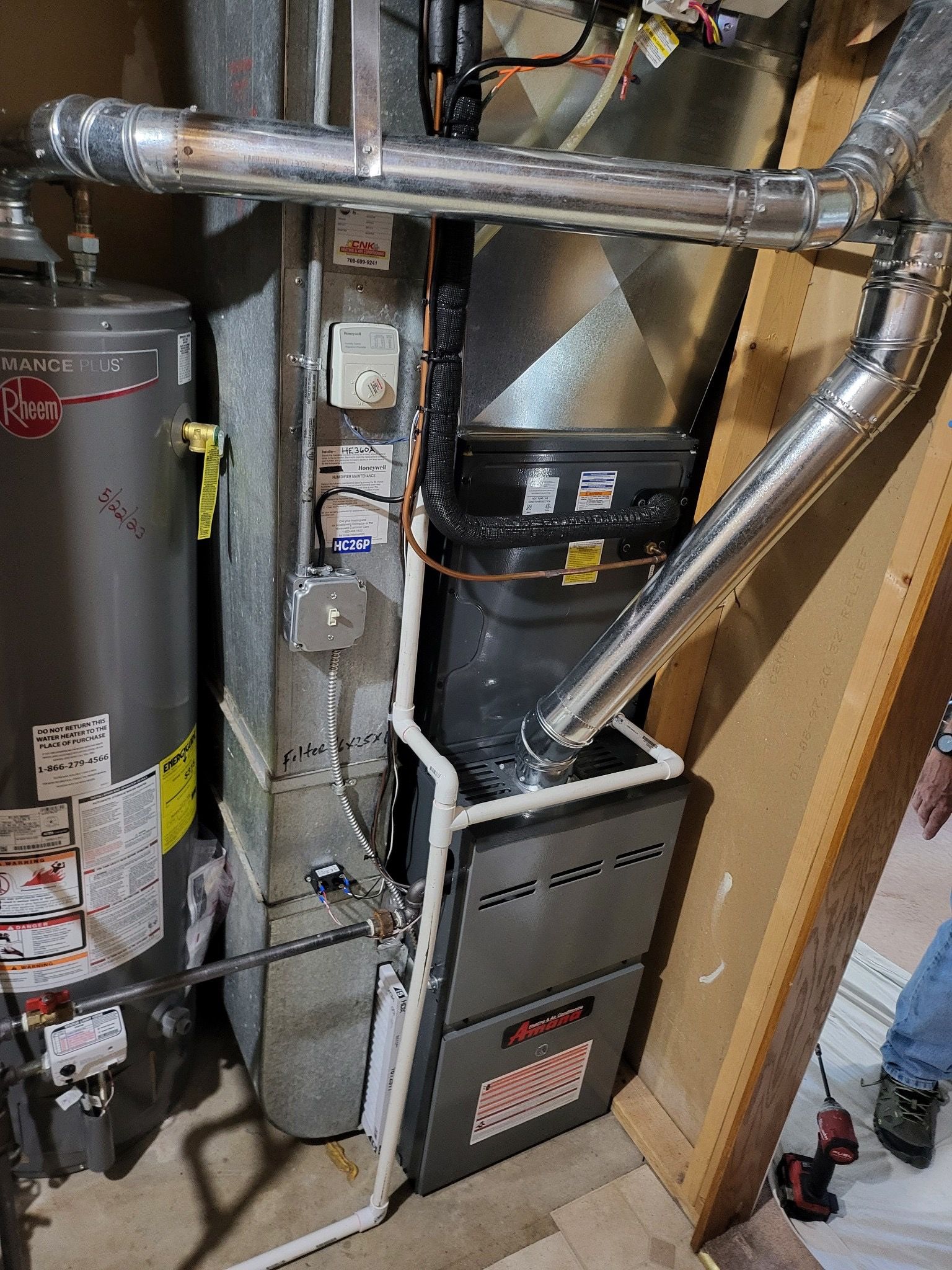 Man Fixing The Machine - Saint John, IN - Elite Comfort Heating And Air Conditioning LLC