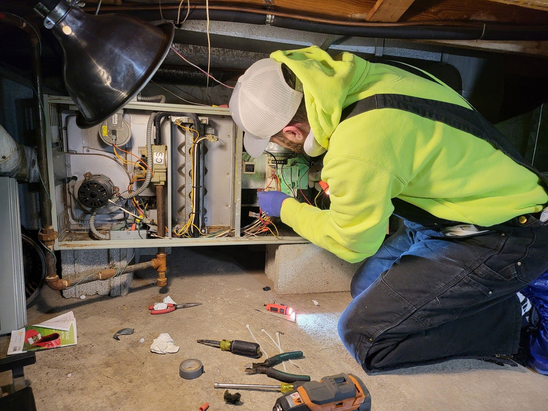 Man Is Working On Boiler - Saint John, IN - Elite Comfort Heating And Air Conditioning LLC
