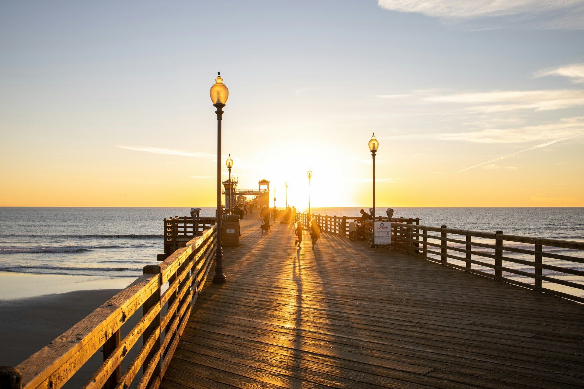 A pier with a sunset in the background