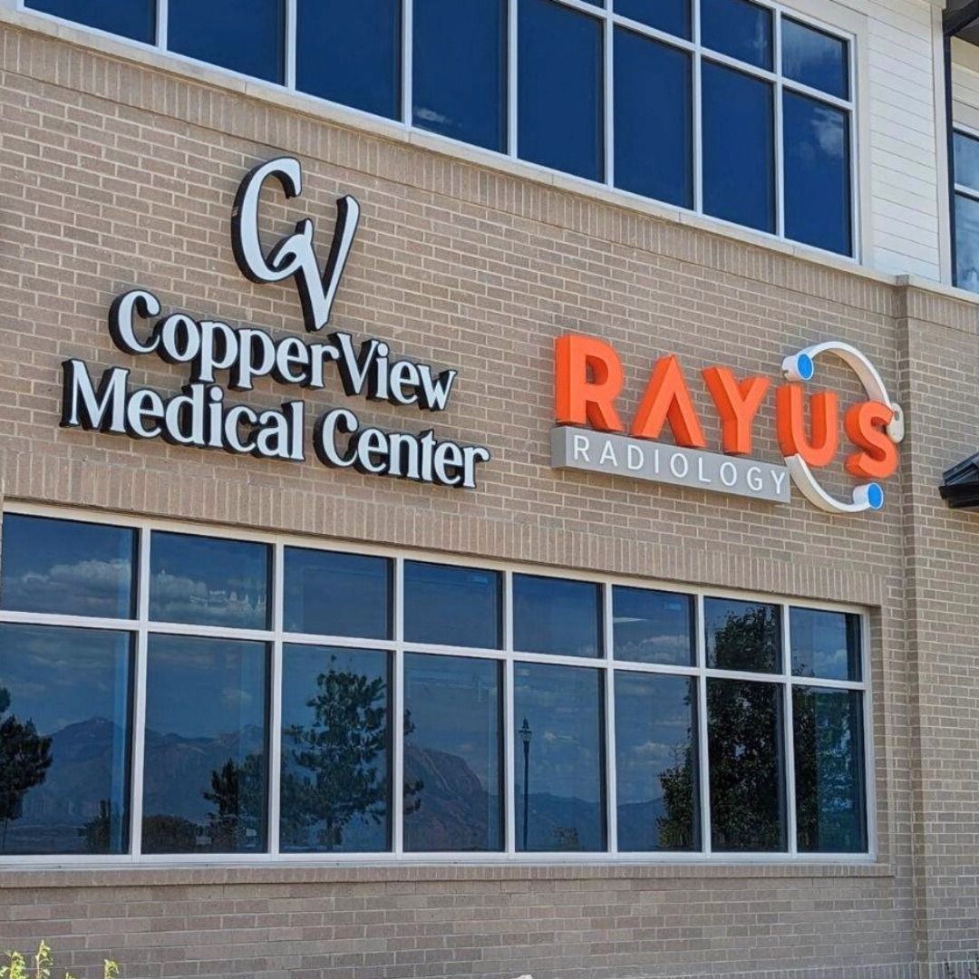 A large brick building with copperview medical center and rayus radiology written on it