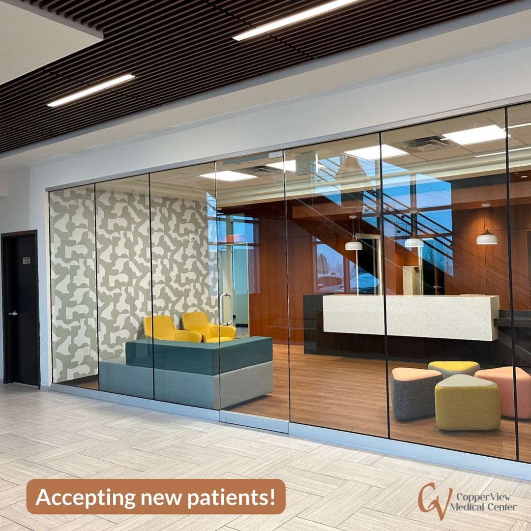 A room with a glass wall and a sign that says accepting new patients