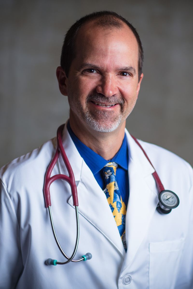 A doctor with a stethoscope around his neck