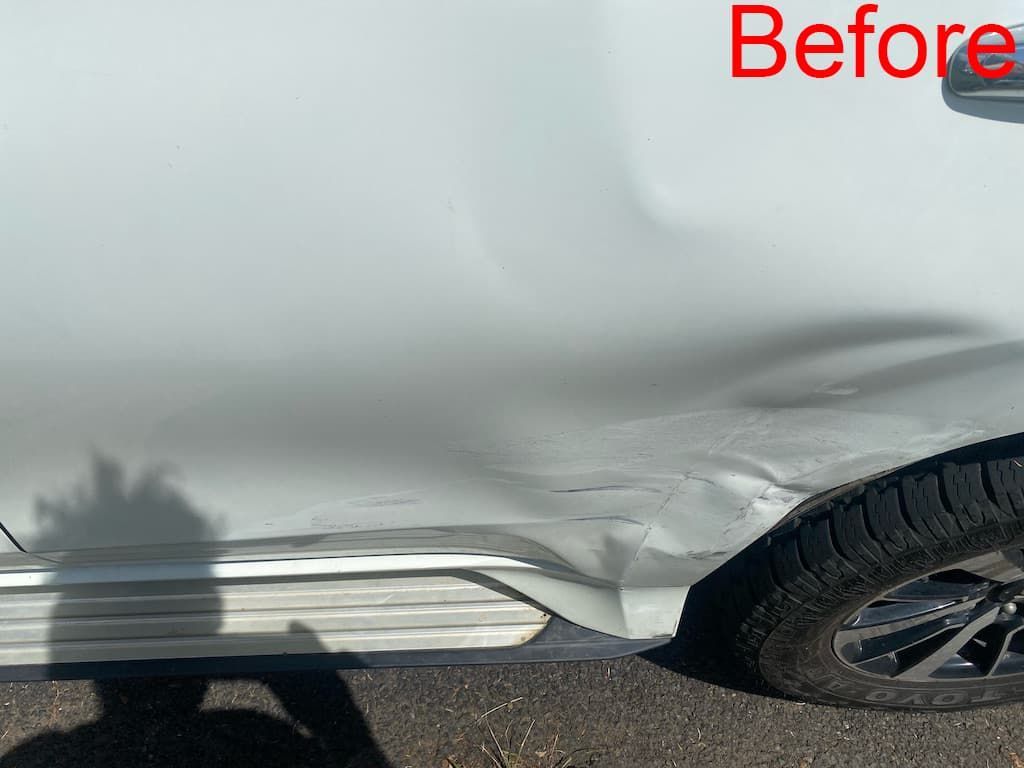Close-up View of a Damaged Rear Fender — Car Restoration in Taree, NSW
