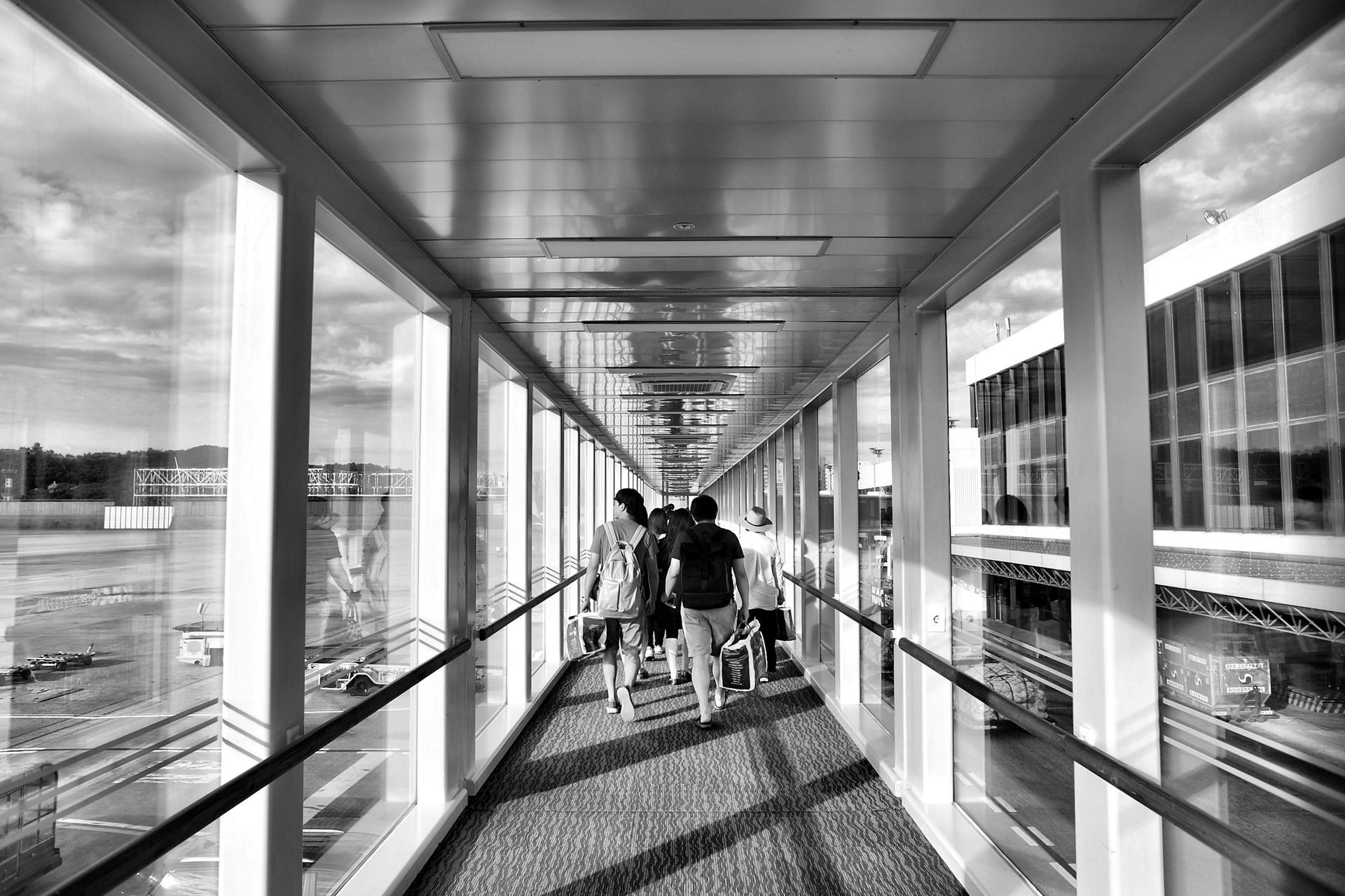 Business and leisure passengers seated side by side showing the contrast in behaviour and travel exp