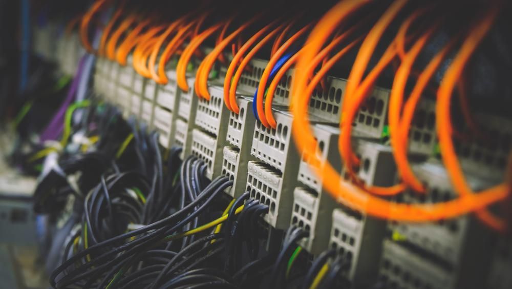 A Bunch of Wires Are Connected to a Server in a Server Room — Reilly Electrical Services in Nambour, QLD