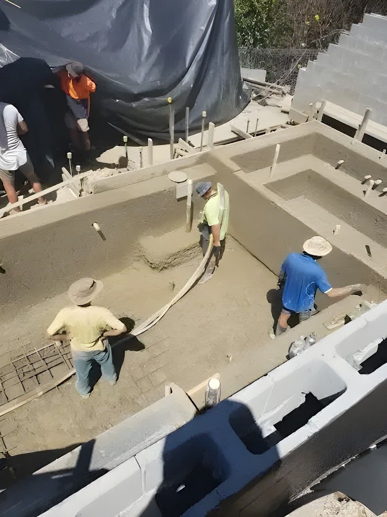 A Group of Construction Workers Are Working on a Pool — Felto's Concrete Line Pumping in Sawtell, NSW