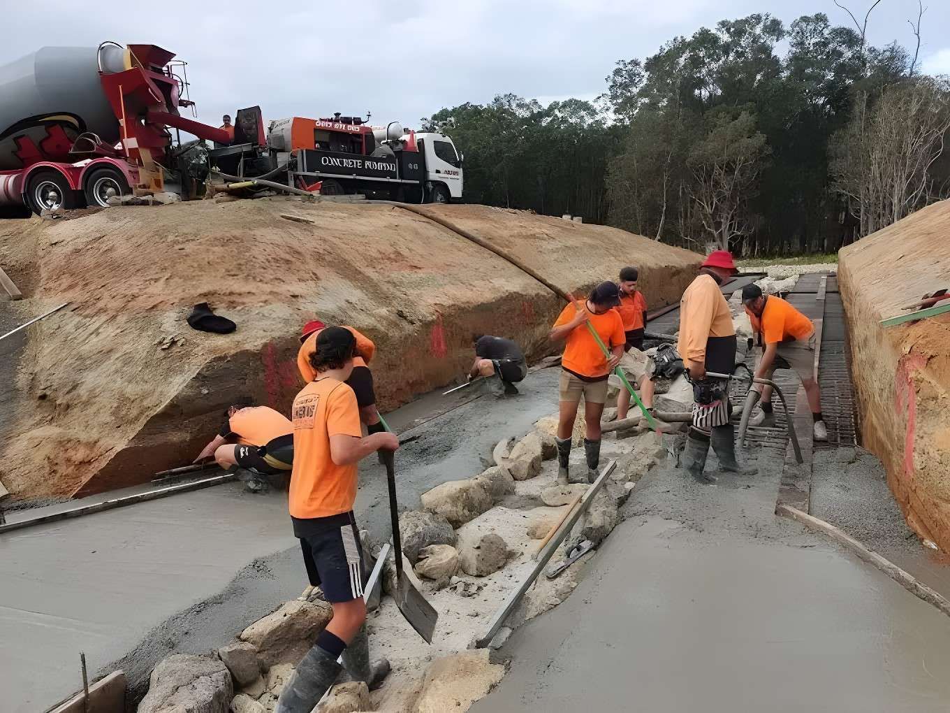 A Group of Construction Workers Are Working on a Road — Felto's Concrete Line Pumping in Sawtell, NSW