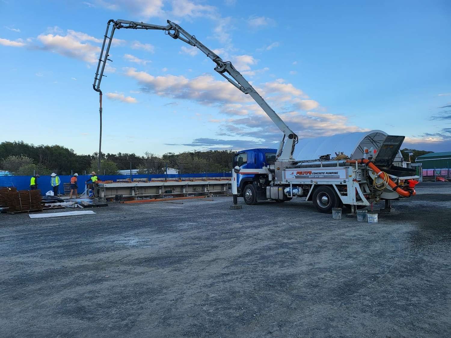Concrete pumping truck in operation at a large outdoor construction site. — Felto's Concrete Line Pumping in Coffs Harbour, NSW