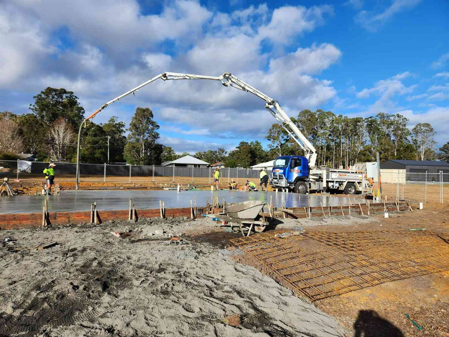 A Concrete Pump is Being Used to Pour Concrete on a Construction Site — Felto's Concrete Line Pumping in Macksville, NSW