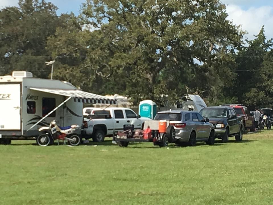 The inside of a moving truck filled with boxes and blankets.