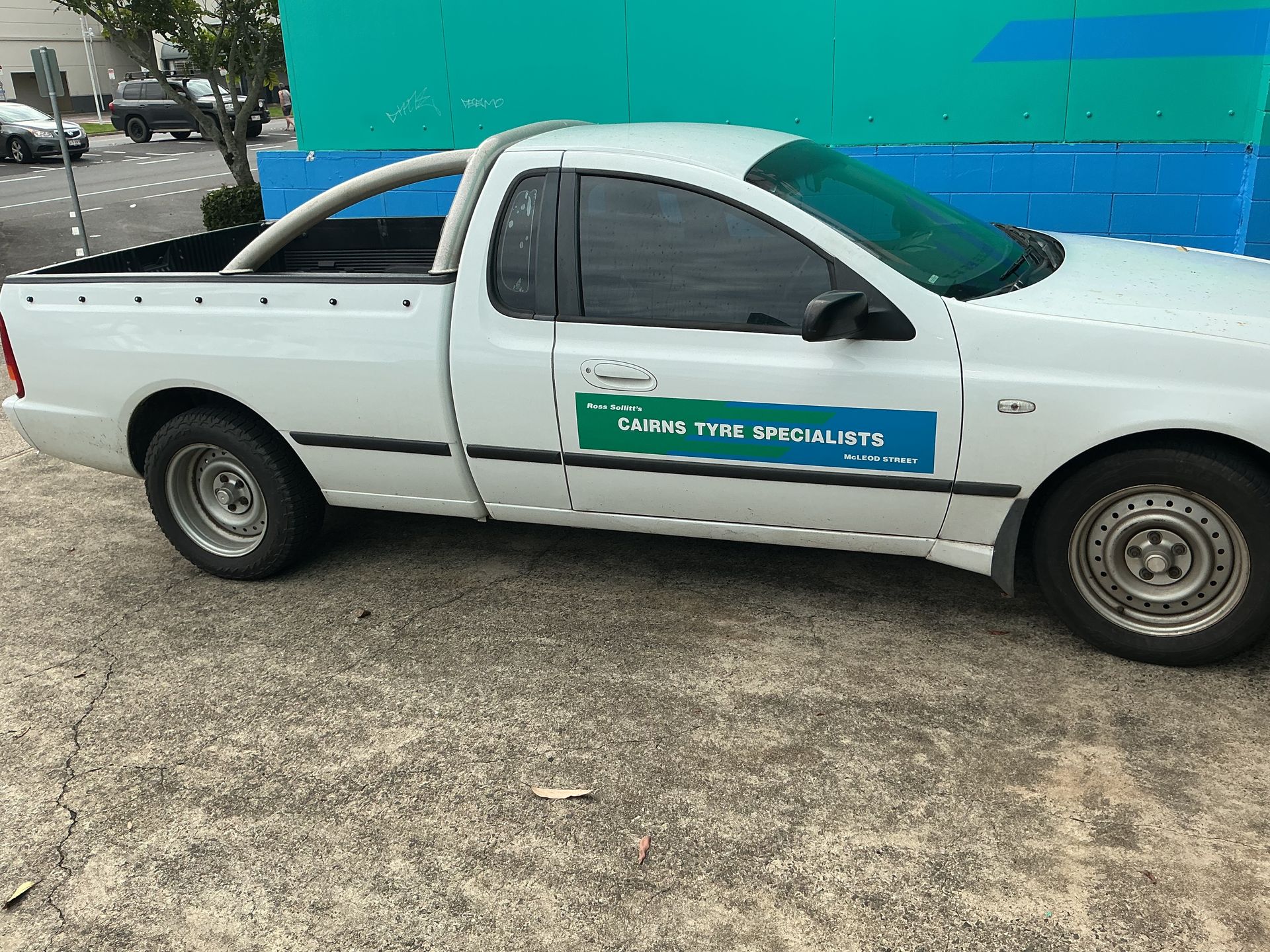 White Pickup Truck With a Roll Bar and Company Signage — Cairns Tyre Specialists In Cairns City, QLD
