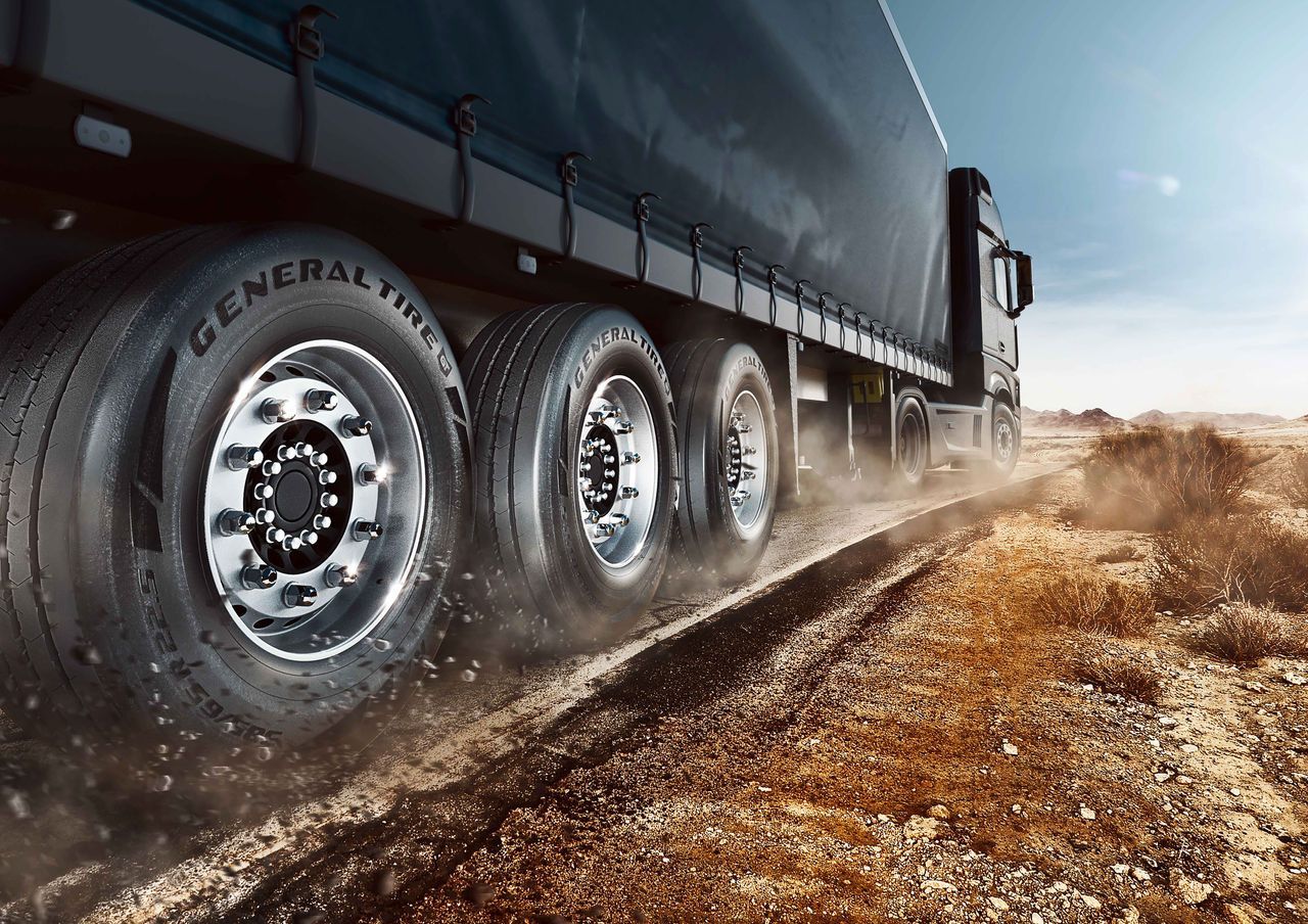 Truck Tires Driving on a Dirt Road — Cairns Tyre Specialists In Cairns City, QLD